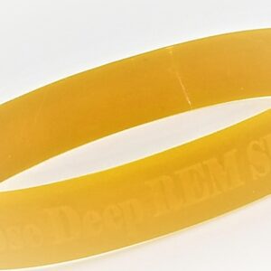 Close-up of yellow rubber bracelet