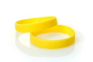 Bright yellow rubber bracelets, two pieces